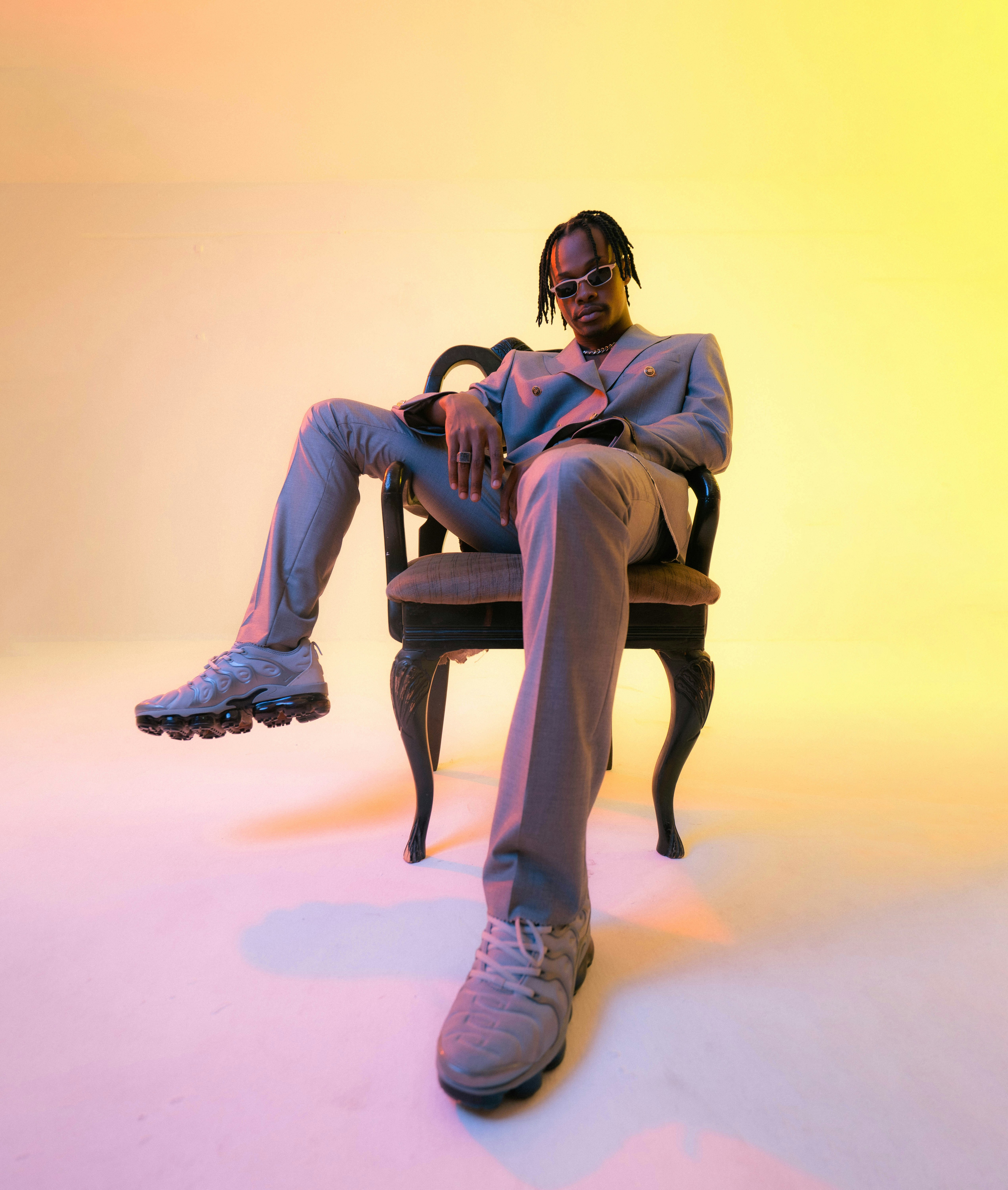Artist seated in studio lighting